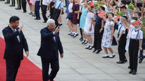 Getty Images Palestinian President Mahmoud Abbas (2 L) is welcomed by President of China Xi Jinping (L) with a welcoming ceremony during his official visit in Beijing, China on July 18, 2017
