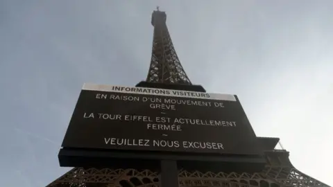 DIMITAR DILKOFF/Getty images Eiffel Tower with a notice of closure in front