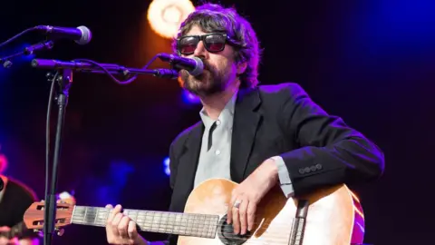 Getty Images / Jeff Spicer Gruff Rhys performing at the Cambridge Folk festival in 2019