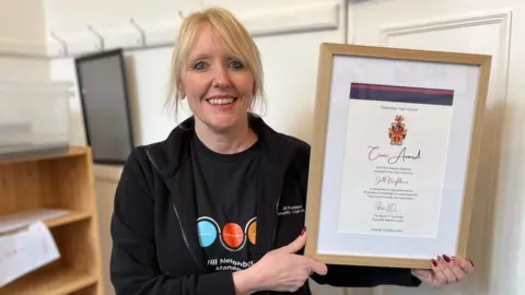 BBC Jill Neighbour holding her civic award