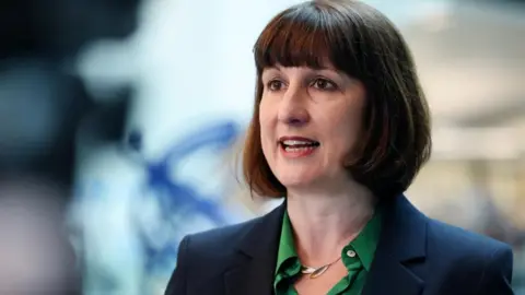 EPA Rachel Reeves, a woman with a short brown bob, speaks