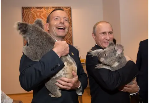 Getty Images In this handout photo provided by the G20 Australia, Australia's Prime Minister Tony Abbott and Russia's President Vladimir Putin meet Jimbelung the koala before the start of the first G20 meeting on 15 November 2014 in Brisbane, Australia.