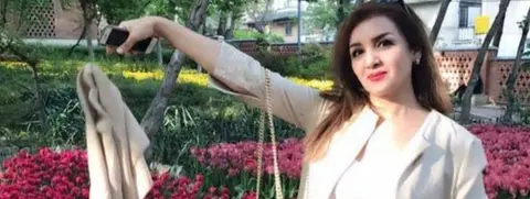 My Stealthy Freedom Iranian woman discarding headscarf