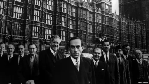 Getty Images James Davidson (second from the right) and other Liberal MPs outside Parliament in 1967