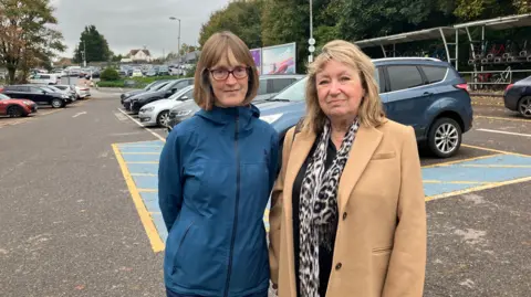 BBC Fiona Scott and Jan Sharman from East Redhill Residents Association in Redhill station car park