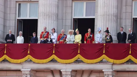 Getty Images The Royal Family on the balcony of Buckingham Palace for the Trooping of the Colour parade - The King and Queen can be seen, along with Prince William and Princess Kate who are with their children - other royals are also on the balcony. All are in ceremonial dress.