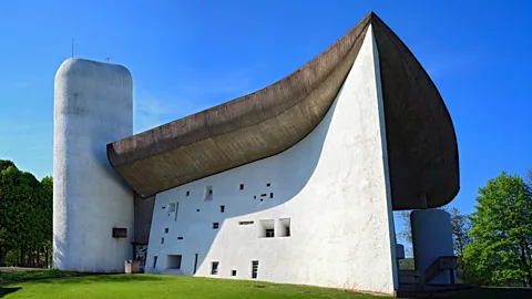 Alamy Notre Dame du Haut in Ronchamp, France was a late masterpiece from Le Corbusier, in which he rebuilt a striking chapel on the site of one from the 4th Century (Credit: Alamy)