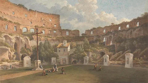 Alamy John Warwick Smith painted the Colosseum’s interior as it looked in the early 19th Century with its lush greenery flourishing and new buildings that had been added (Credit: Alamy)