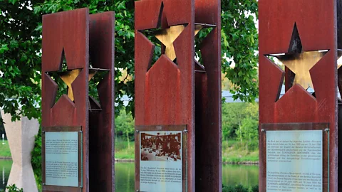 Arterra Picture Library/Alamy Three steles outside the European Museum commemorate the founding members of the Schengen Agreement (Credit: Arterra Picture Library/Alamy)