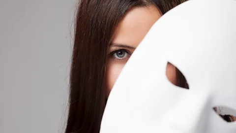 Getty Images Woman behind mask (Credit: Getty Images)