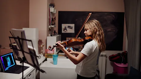 Getty Images Members of time banks offer and receive services such as music lessons, painting services or language instruction (Credit: Getty Images)