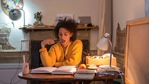 Alamy File image of a woman sitting at a desk