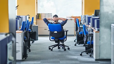 Getty Man sitting in empty office