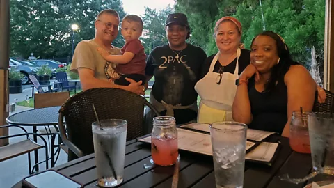 Courtesy of Dixie Benca Dixie Benca (second from right) has implemented on-site childcare her restaurant, McGee's Scot-Irish Pub, in South Carolina, US (Credit: Courtesy of Dixie Benca)