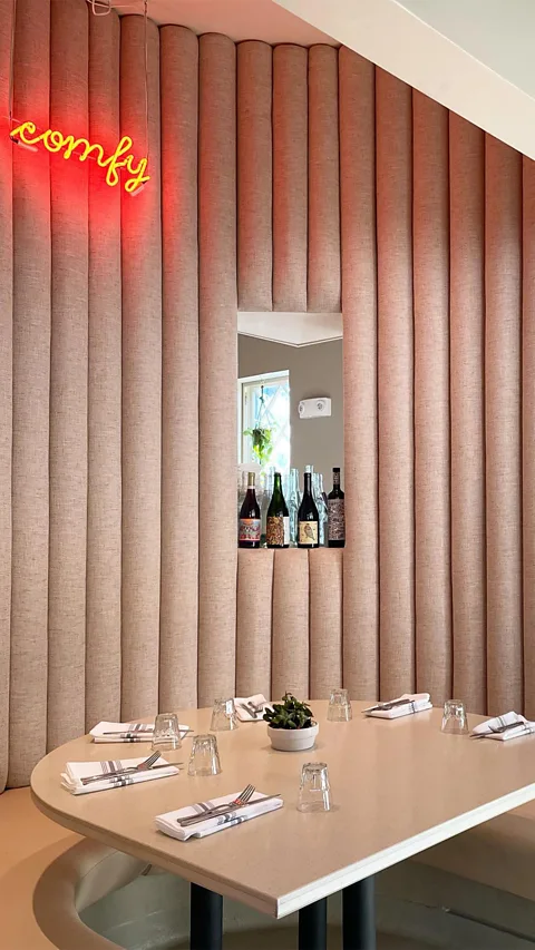 Comfort Kitchen Curved, pale-pink banquettes abound in Comfort Kitchen (Credit: Comfort Kitchen)