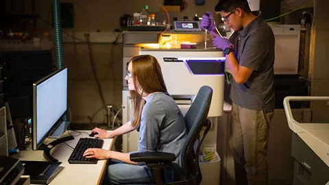 Craig Fritz Sandia National Laboratories scientists Jessica Kustas and Andre Benally are working on a filtration system able to capture a wide range of PFAS (Credit: Craig Fritz)