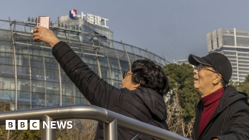 Evergrande shares rise as Hong Kong trading resumes