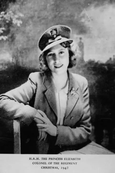 Getty Images Black-and-white photo of Princess Elizabeth in a dark coat and cap with badge. The card contains the words: HRH The Princess Elizabeth, Colonel of the Regiment, Christmas 1942.