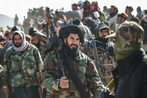AFP Taliban security personnel gather at the site two days after air strikes by Pakistan in the Barmal district of eastern Paktika province on December 26, 2024. Pakistan air strikes in an eastern border region of Afghanistan killed 46 civilians, the Taliban government said on December 25, whilst a Pakistan security official said the bombardment had targeted "terrorist hideouts".