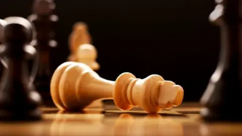 Thinkstock A chessboard with a piece knocked over