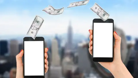 Getty Images Mobile payment or money transfer with smartphone