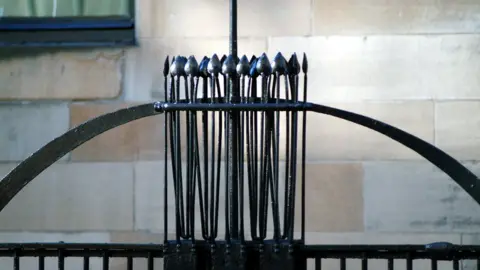 McAteer Photograph Railings featuring a sequence of Japanese-influenced symbols on stalks