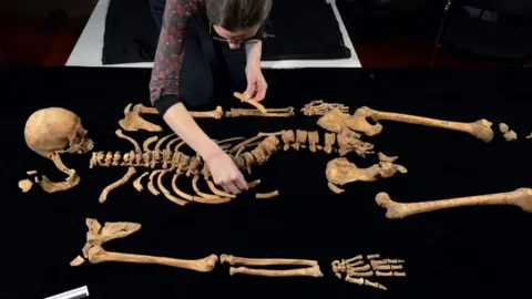 Picture shows Dr Jo Appleby, Lecturer in Human Bioarchaeology at The University of Leicester, working on the remains of King Richard III