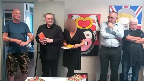 Reach Project (Left to right) Robin Stewart, Reach project, Michael Stone, Karen Stone, DUP East Belfast Councillor George Dorrian, former DUP MLA Sammy Douglas