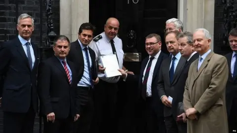 PA A group of former ministers hand in a petition to Downing Street