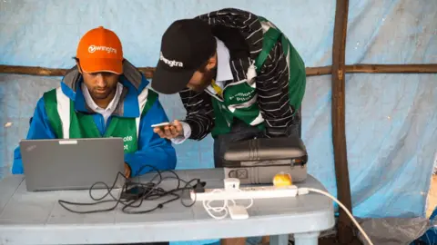 Sala Lewis/World Bank Engineers monitor the drone's progress