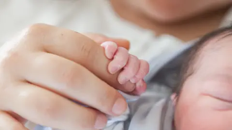 Getty Images Baby and parent