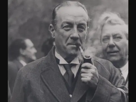PA Picture of Stanley Baldwin smoking a pipe