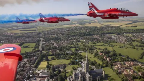 EPA Armed Forces Day is marked by a Red Arrows flypast over Salisbury Cathedral.
