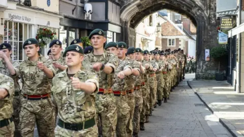 PA Media Members of the armed forces marched through Salisbury city centre
