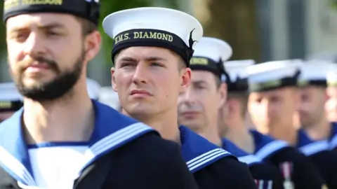 PA Media British Army of Royal Navy personnel marching through Salisbury city centre