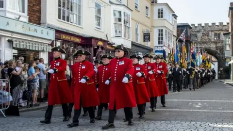 PA Media The British Army of members of the armed forces marching through Salisbury