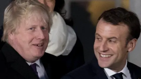 Getty Images Boris Johnson and Emmanuel Macron during a summit at the Royal Military Academy Sandhurst, in Camberley, on January 18, 2018
