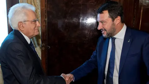 Reuters Italy's President Sergio Mattarella shakes hands with League leader Matteo Salvini in Rome