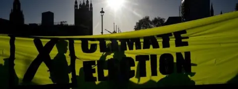 Getty Images A banner at a Fridays for Future campaign event in Westminster