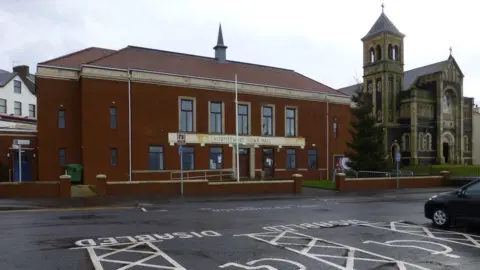Geograph/Kenneth Allen Portstewart Town Hall. To the right is the Star of the Sea RC Church