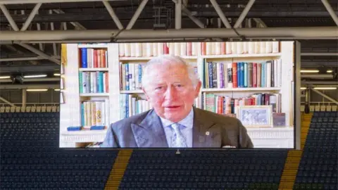 Getty Images A pre-recorded message from Prince Charles was played on a big screen during the opening ceremony