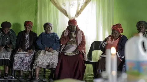 Alamy Women sitting for a funeral