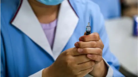 Getty Images A nurse preparing a pneumococcal conjugate vaccine at a community healthcare centre in China.