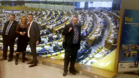 Creagh Lane Action Group John Boland at the European Parliament with some of the politicians who organised the visit