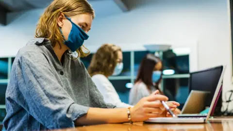 Getty Images Students wearing masks