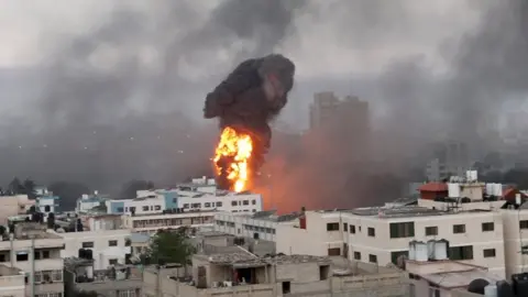 Reuters Smoke and flames rise during Israeli air strikes amid a flare-up of Israeli-Palestinian violence in Gaza