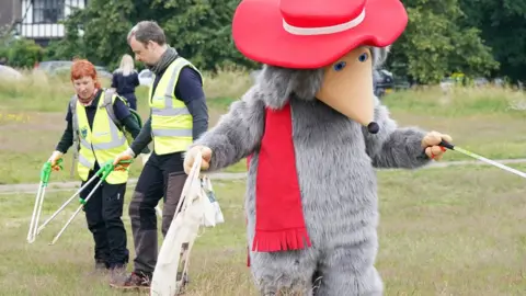 PA Media Head Womble Orinoco joined by The Conservation Volunteers during an hour of litter-picking on Wimbledon Common
