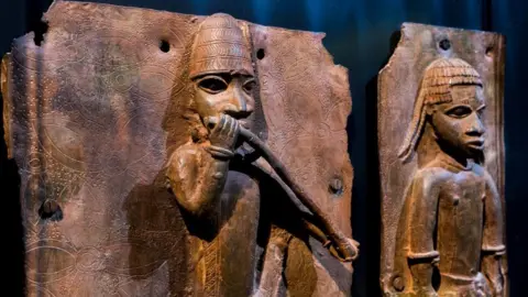 Getty Images Sculptures looted by British soldiers from the Kingdom of Benin in 1897 hangs on display in the "Where Is Africa" exhibition at the Linden Museum