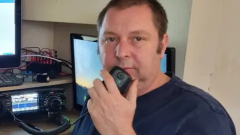John Emery John Emery using his radio equipment