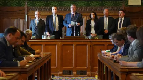 PA Media Sir Graham Brady, chairman of the 1922 Committee, announces the results of the second ballot round in the Conservative Party leadership contest, in the Houses of Parliament